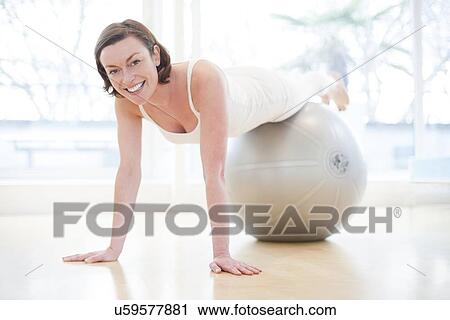 Clip Art - Woman on exercise ball. Fotosearch