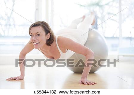 Drawing - Woman on exercise ball. Fotosearch