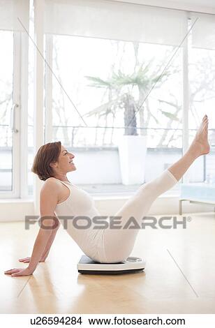 Stock Illustration - Woman on scales. Fotosearch