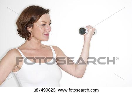 Woman using hand weight View Large Illustration Drawing - Woman using hand weight. Fotosearch