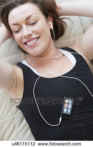 Drawing - Woman wearing earphones. Fotosearch