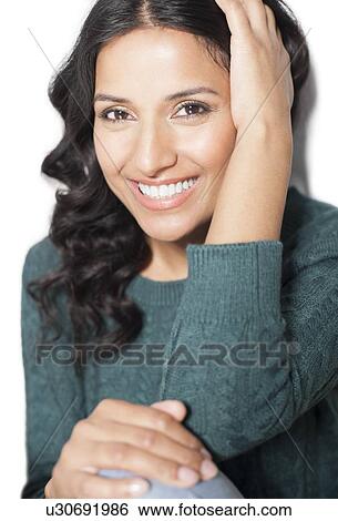 Stock Illustration - Woman wearing green jumper. Fotosearch