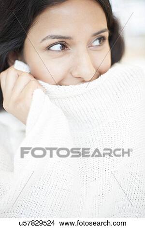 Stock Illustration - Woman wearing white jumper. Fotosearch
