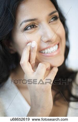 Stock Illustration - Woman with fingers crossed. Fotosearch
