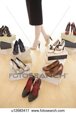 Stock Illustration - Woman with shoes. Fotosearch