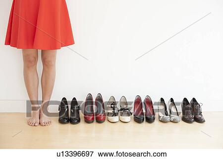 Stock Illustration - Woman with shoes. Fotosearch