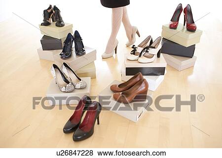 Stock Illustration - Woman with shoes. Fotosearch