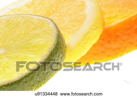 Stock Illustration - Slices of citrus fruit, studio shot.. Fotosearch