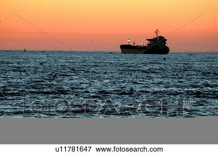 Stock Illustration - Beach scene with oil tanker. Fotosearch