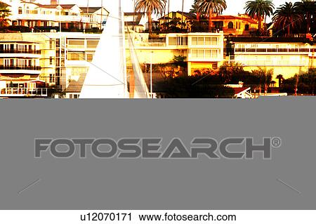 sailboat in ocean with buildings in background View Large Illustration Clip Art - sailboat in ocean with buildings in background. Fotosearch