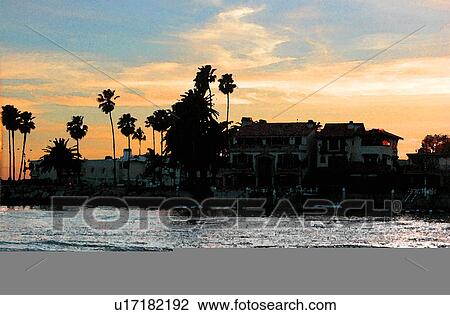 Drawing - silhoutte view of coastal community. Fotosearch