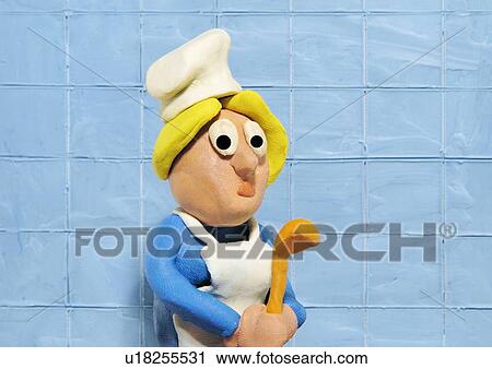 Cook wearing chef's hat and apron holding spoon View Large Illustration Clip Art - Cook wearing chef's hat and apron holding spoon. Fotosearch