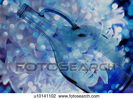 Close-up of a bottle superimposed on a pattern of flowers View Large Illustration Drawing - Close-up of a bottle superimposed on a pattern of flowers. Fotosearch