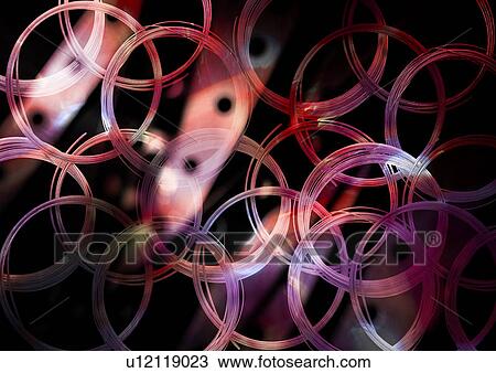 Colored rings superimposed on a black background View Large Illustration Drawing - Colored rings superimposed on a black background. Fotosearch