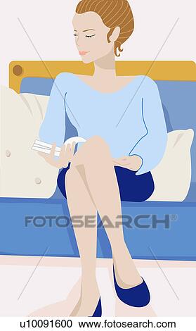 Close-up of a young woman sitting on a couch and holding a book View Large Illustration Clipart - Close-up of a young woman sitting on a couch and holding a book. Fotosearch