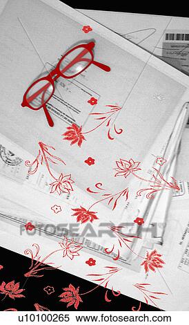 Close-up of eyeglasses and flowers on documents View Large Illustration Stock Illustration - Close-up of eyeglasses and flowers on documents. Fotosearch
