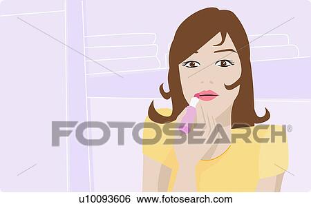 Stock Illustration - Portrait of a young woman applying lipstick. Fotosearch