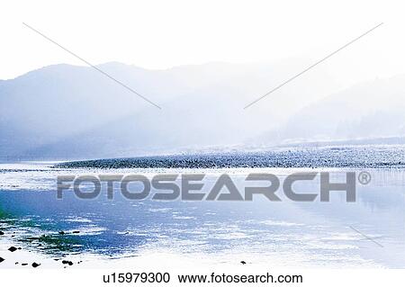 Stock Image - Mountain range beyond the river, Japan, composition, computer graphics. Fotosearch