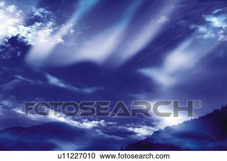 Stock Image - The clouds in the sky, Japan, low angle view, composition, computer graphics. Fotosearch