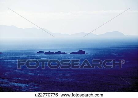 Stock Photograph - The ocean and silhouette of mountain range, Japan, composition, computer graphics. Fotosearch