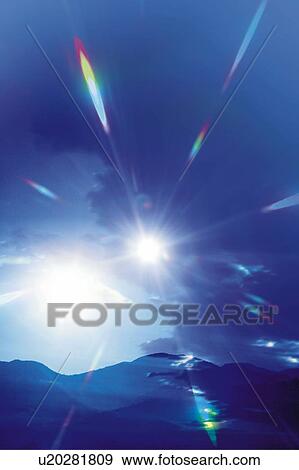 Stock Photo - The sun over the mountains, Japan, composition, computer graphics, lens flare. Fotosearch