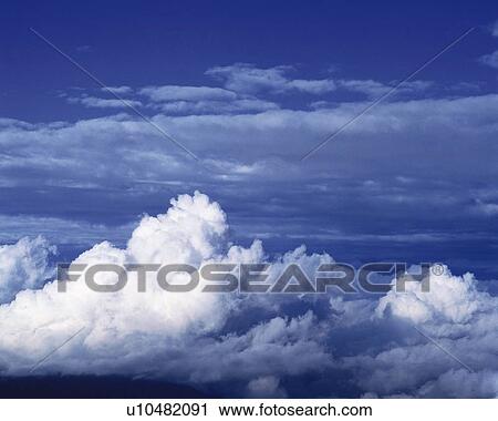Stock Image - Blue sky and Clouds, High angle view. Fotosearch