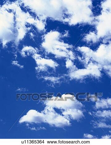 Blue sky and Clouds, Low angle view View Large Photo Image Picture - Blue sky and Clouds, Low angle view. Fotosearch