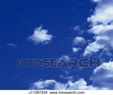 Blue sky and Clouds, Low angle view View Large Photo Image Picture - Blue sky and Clouds, Low angle view. Fotosearch