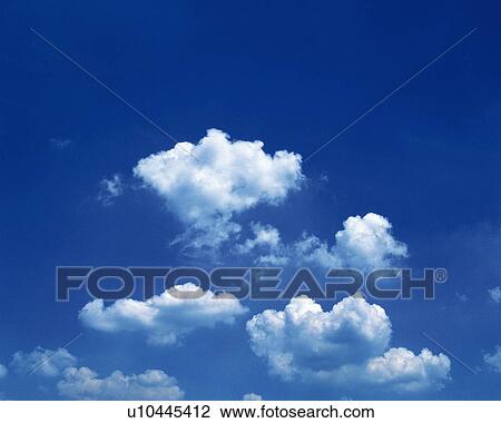 Stock Image - Blue sky and Clouds, Low angle view. Fotosearch
