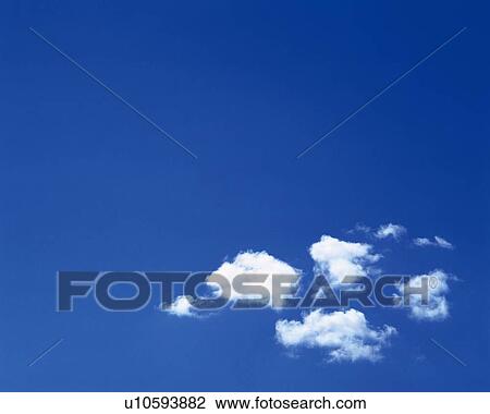 Stock Image - Blue sky and Clouds, Low angle view, Copy Space, . Fotosearch