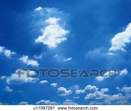 Stock Image - Blue sky and Clouds, Low angle view. Fotosearch