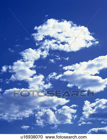 Stock Image - Blue sky and Clouds, Low angle view. Fotosearch