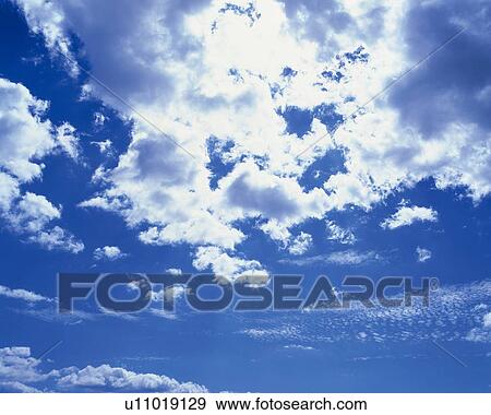 Stock Photo - Blue sky and Clouds, Low angle view. Fotosearch
