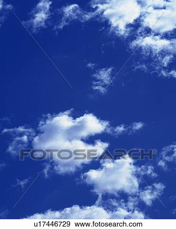 Stock Photo - Blue sky and Clouds, Low angle view. Fotosearch