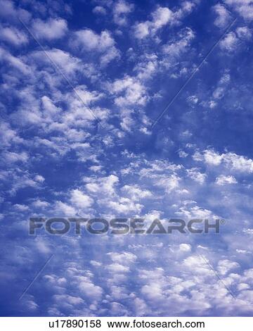 Stock Photo - Blue sky and Clouds, Low angle view, Full frame. Fotosearch