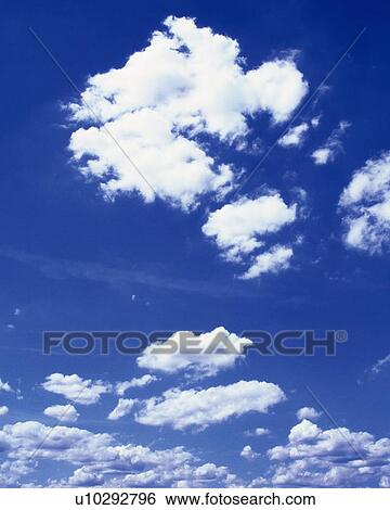 Stock Photograph - Blue sky and Clouds, Low angle view. Fotosearch