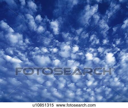 Stock Photography - Blue sky and Clouds, Low angle view, Full frame. Fotosearch