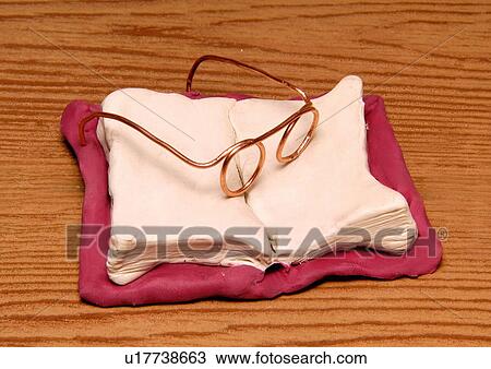 Eyeglasses on an open book View Large Illustration Drawing - Eyeglasses on an open book. Fotosearch