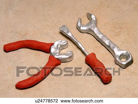Drawing - Pliers, flathead screwdriver, and key tools. Fotosearch