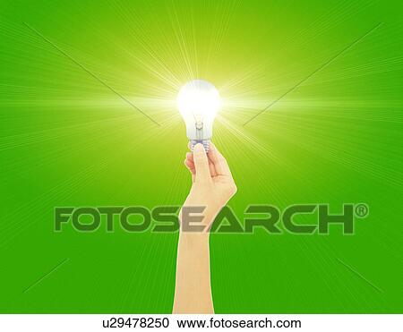 Clipart - Close-up of a hand holding bulb. Fotosearch
