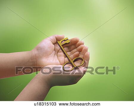 Drawing - Close-up of hands holding a key. Fotosearch