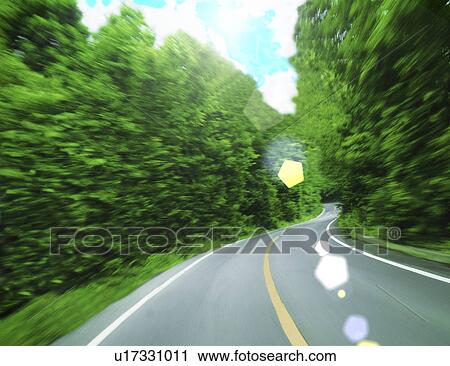 Clip Art - View of a road amid trees. Fotosearch