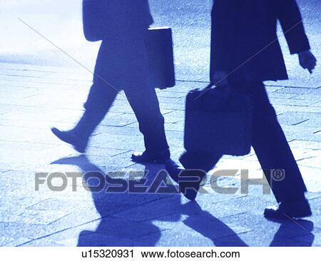 Clip Art - Two businessmen walking on street. Fotosearch
