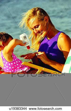 Picture - Females, Chairs, Oceans, Ocean, Kid, Chair, Kids. Fotosearch