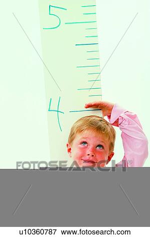 Humans, People, Kids, Cute, Growing, Meter, Human View Large Photo Image Stock Photo - Humans, People, Kids, Cute, Growing, Meter, Human. Fotosearch