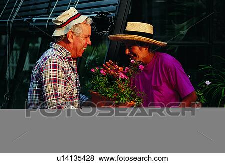 People, Flower, Smiles, Plants, Humans, Green houses, Smile View Large Photo Image Stock Photo - People, Flower, Smiles, Plants, Humans, Green houses, Smile. Fotosearch