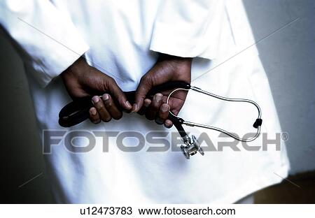 African American doctor holding stethoscope View Large Photo Image Stock Image - African American doctor holding stethoscope. Fotosearch