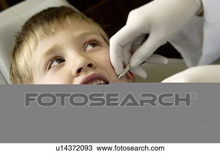 Boy getting dental exam View Large Photo Image Stock Image - Boy getting dental exam. Fotosearch