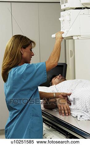 Stock Photography - Patient having an xray taken. Fotosearch
