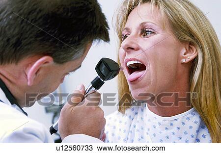 Physician examining patient View Large Photo Image Stock Image - Physician examining patient. Fotosearch